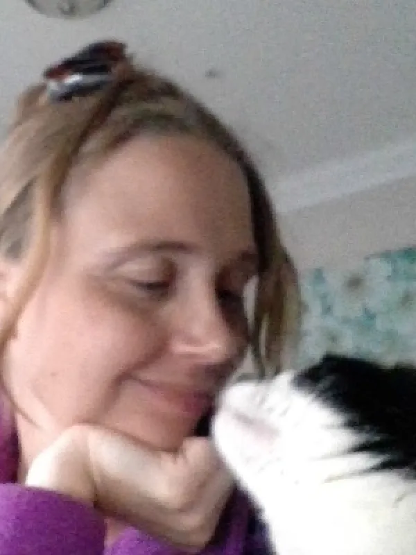 Woman smiling at cat